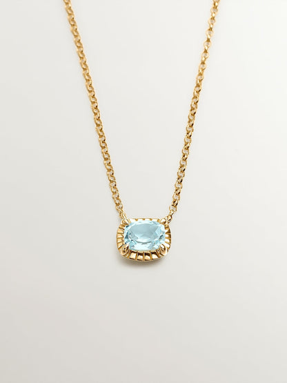 Colgante de plata 925 bañada en oro amarillo de 18K con topacio azul sky