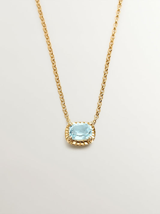 Colgante de plata 925 bañada en oro amarillo de 18K con topacio azul sky