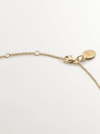 Colgante de plata 925 bañada en oro amarillo de 18K con topacio azul sky y zafiros blancos