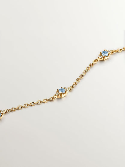 Pulsera de plata 925 bañada en oro amarillo de 18K con topacios azul swiss y blanco
