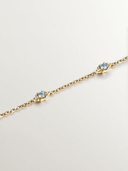 Pulsera de plata 925 bañada en oro amarillo de 18K con topacios azul swiss y blanco