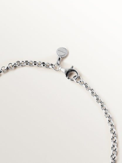 Colgante trenzado de plata 925 bañada en rodio y oro amarillo de 18K con pavé de topacios blancos