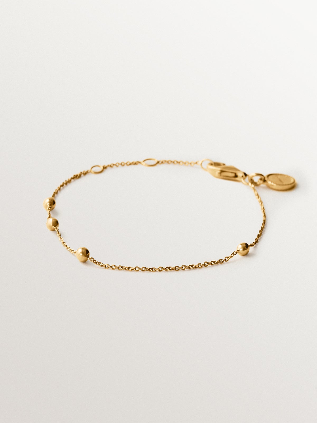 Pulsera de plata 925 bañada en oro amarillo de 18K con motivo de esferas