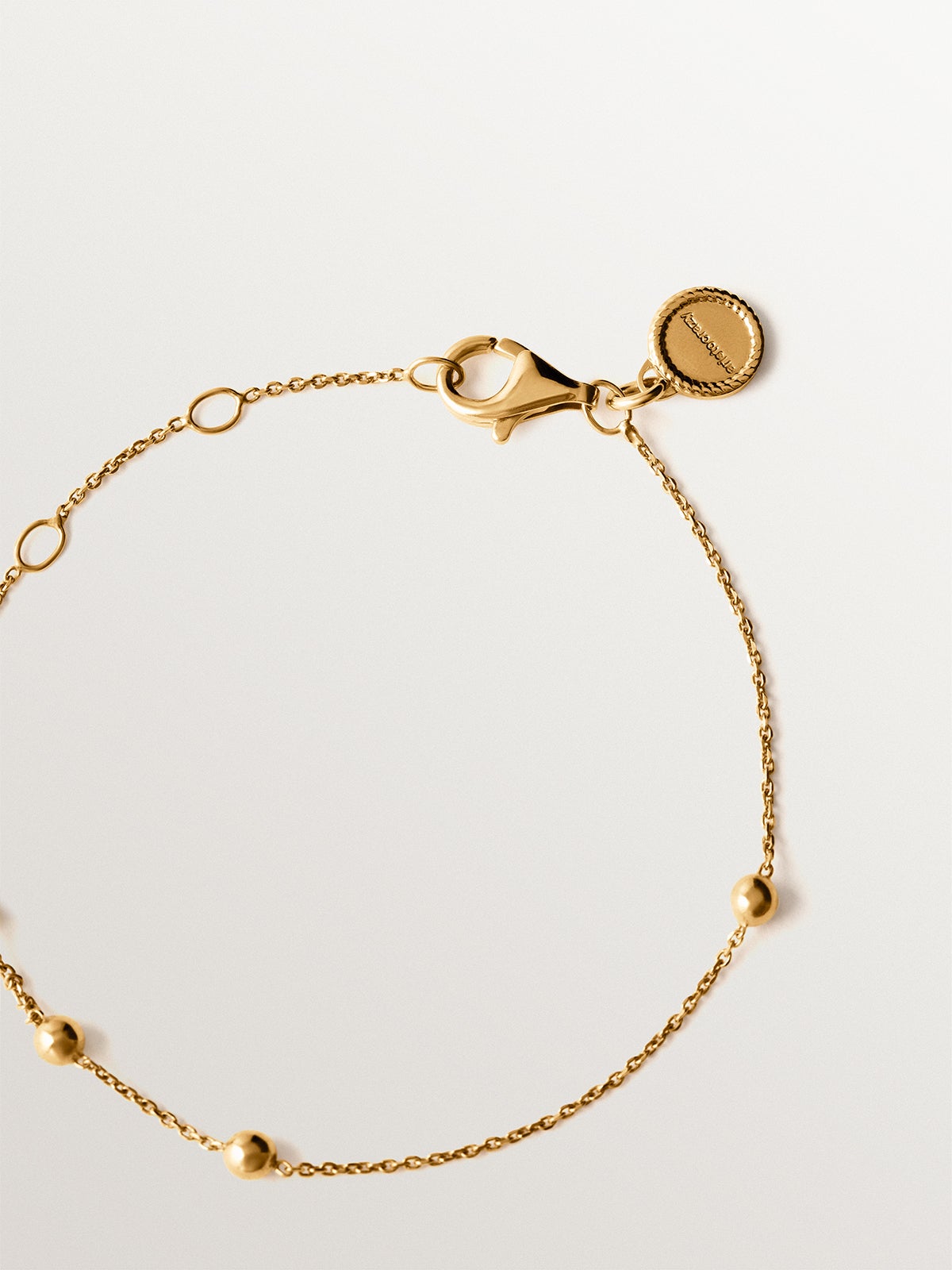 Pulsera de plata 925 bañada en oro amarillo de 18K con motivo de esferas