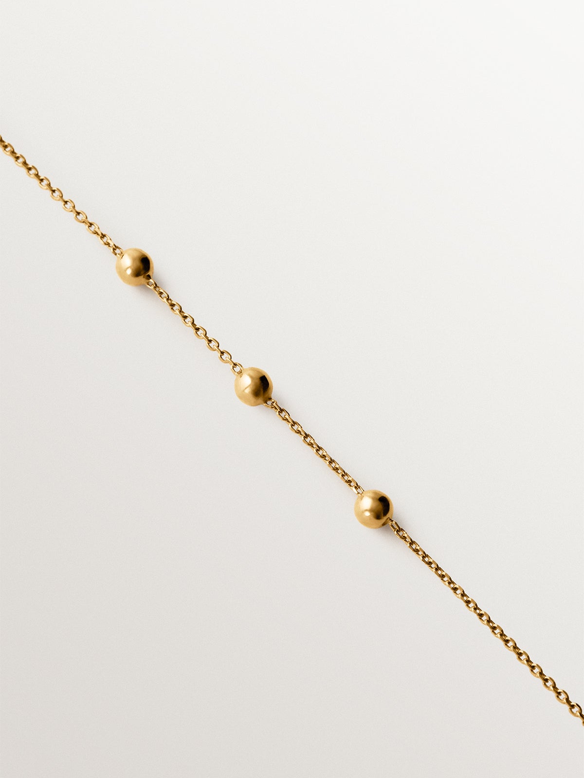 Pulsera de plata 925 bañada en oro amarillo de 18K con motivo de esferas
