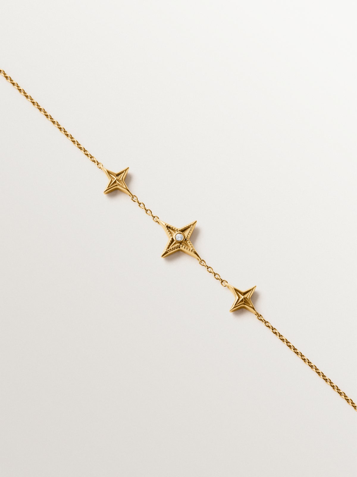 Pulsera de plata 925 bañada en oro amarillo de 18K con topacio blanco y forma de estrellas